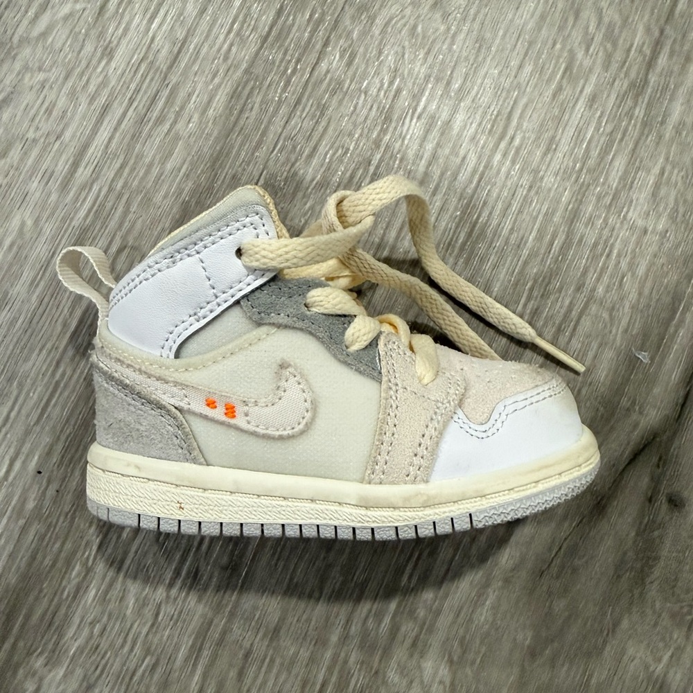 Jordan 1 Mid Craft SE Baby Beige White High-Top Sneakers with Orange Accent